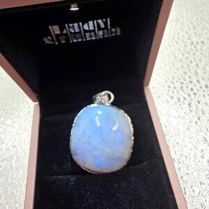 925 sterling silver pendant featuring an oval-shaped Rainbow Moonstone gemstone.
